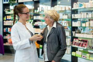 Pharmacist and grateful senior woman.